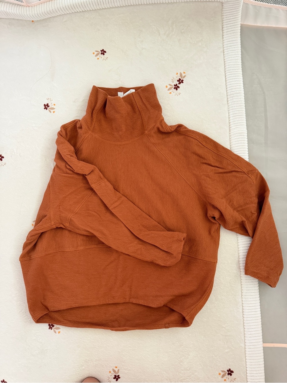 LULULEMON Turtleneck Sweater in burnt orange.